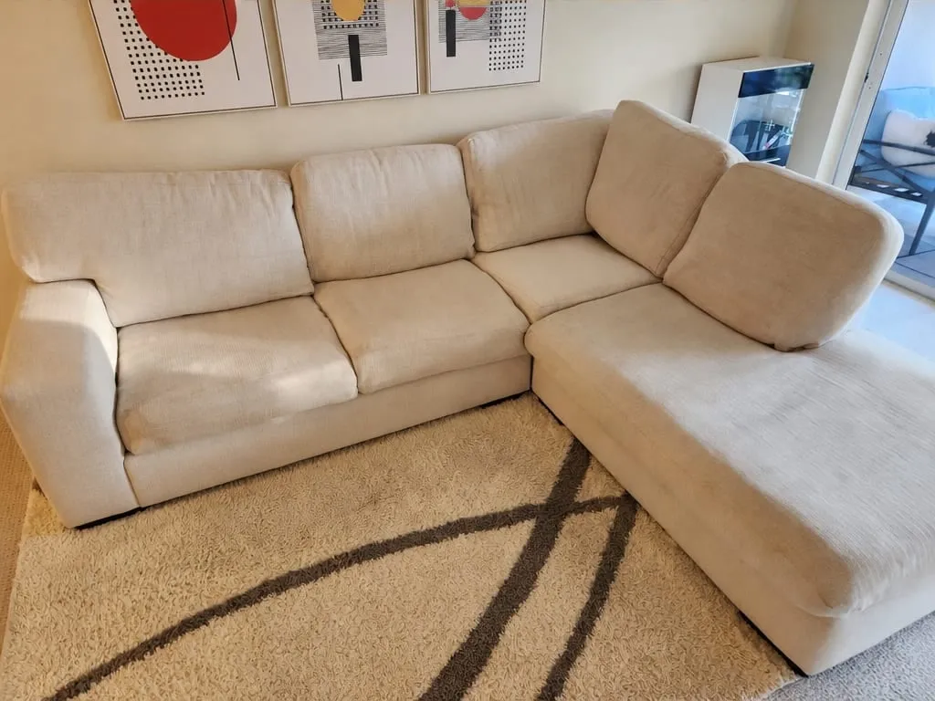 After — Beige fabric sectional sofa before and after professional cleaning
