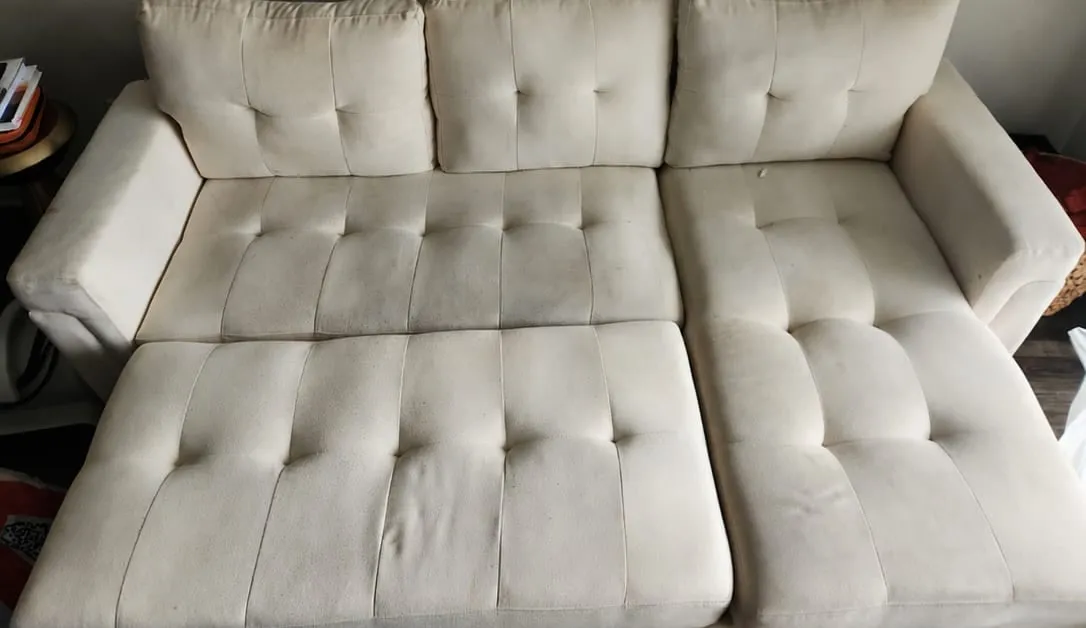 Before — White sectional sofa restored from soiled to bright white