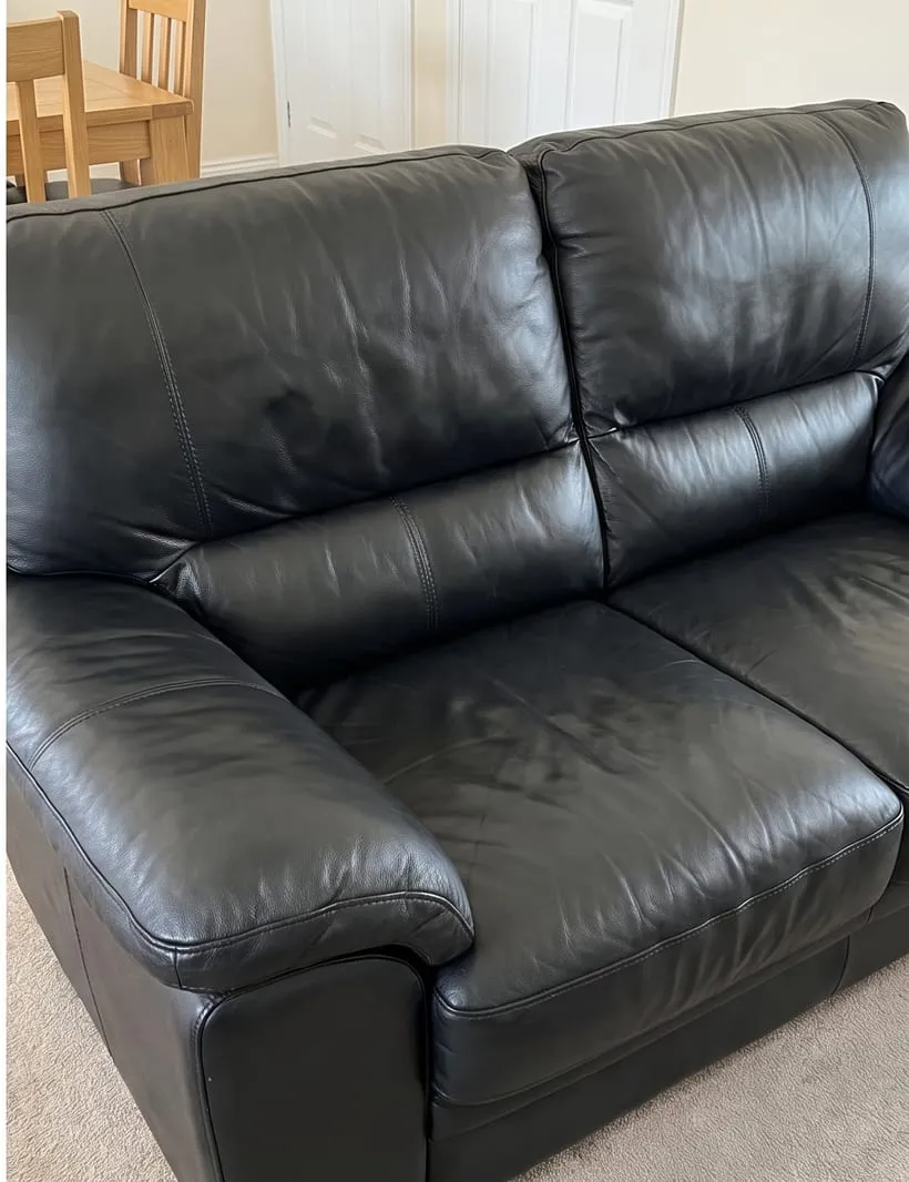 After — Black leather sofa before and after cleaning and conditioning