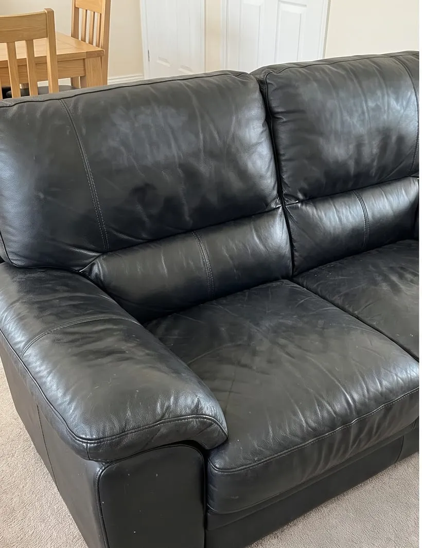 Before — Black leather sofa before and after cleaning and conditioning