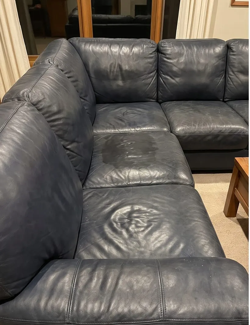 Before — Blue leather sectional restored after cleaning and conditioning