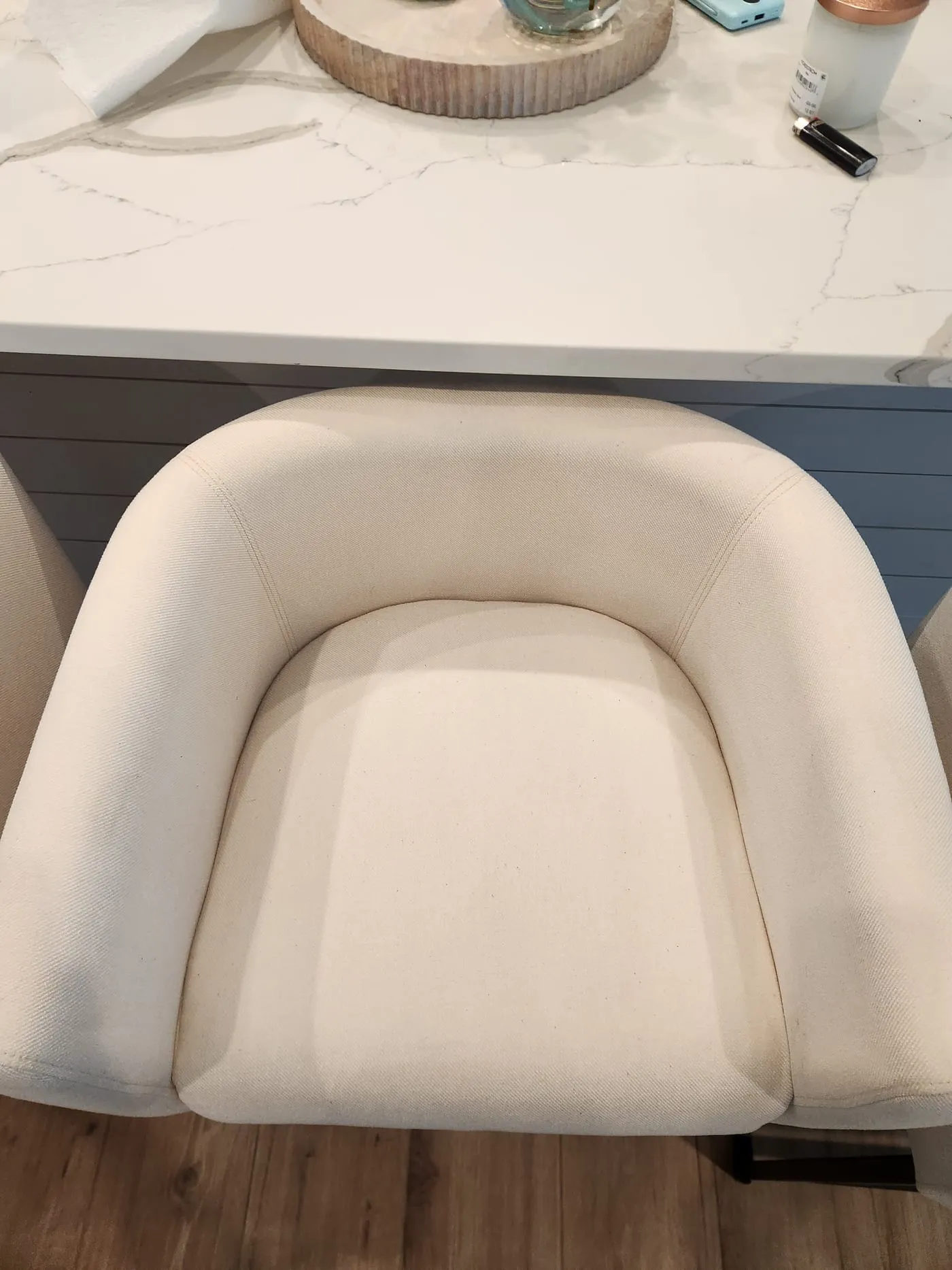 White upholstered dining chairs cleaned to a spotless finish