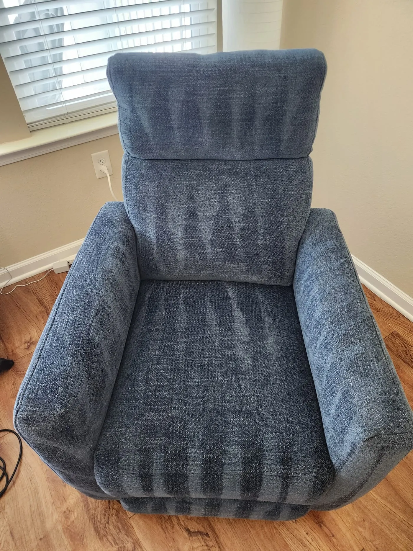Blue upholstered recliner cleaned to a uniform finish