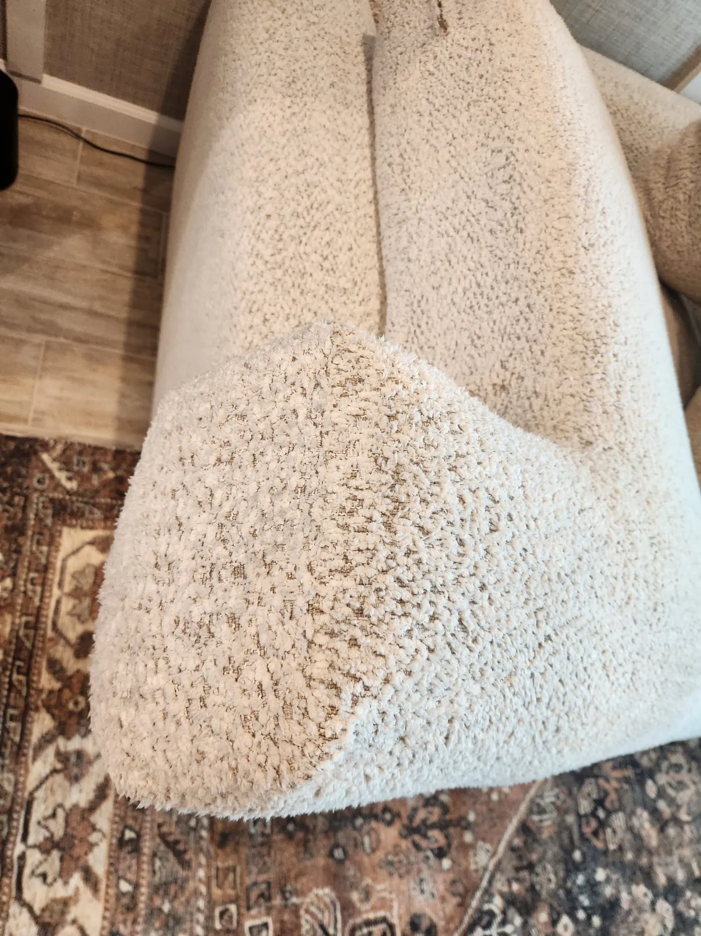 Cream boucle sofa restored to a soft, clean texture