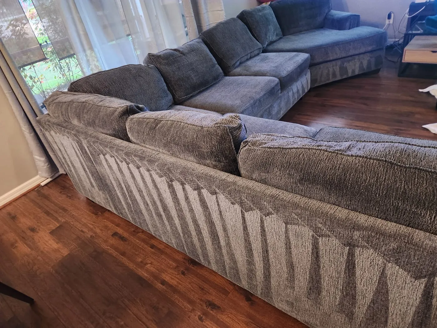 Large grey sectional sofa restored after deep extraction