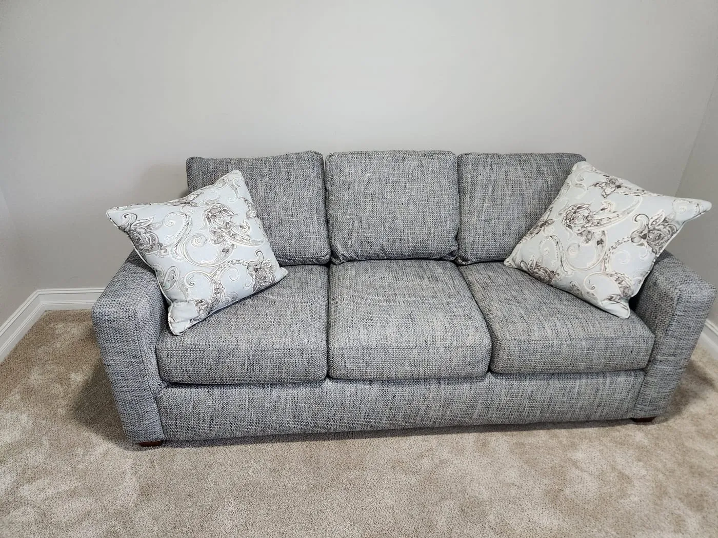 Freshly cleaned grey tweed sofa with restored, even color