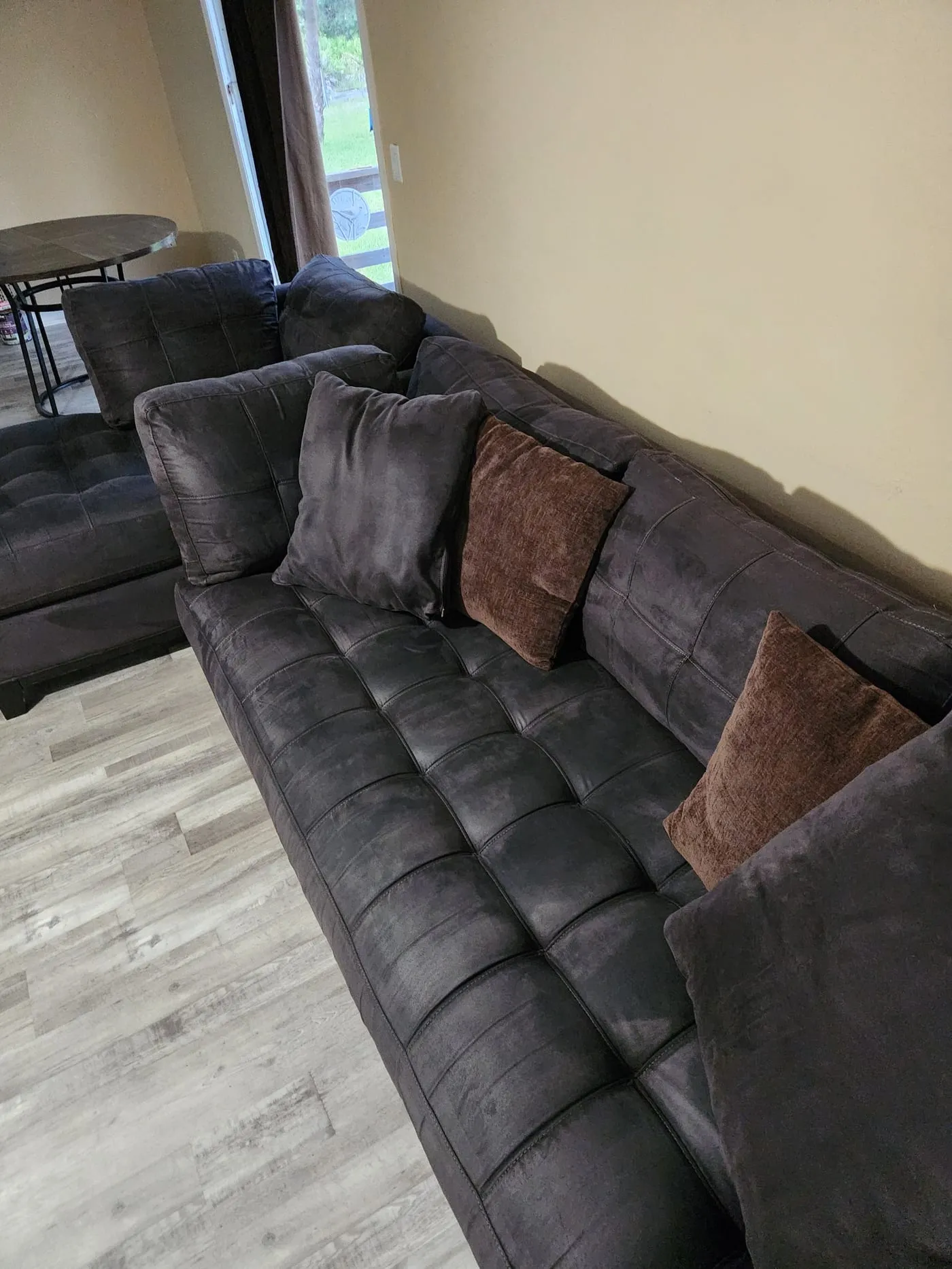Cream sofa restored after professional upholstery cleaning