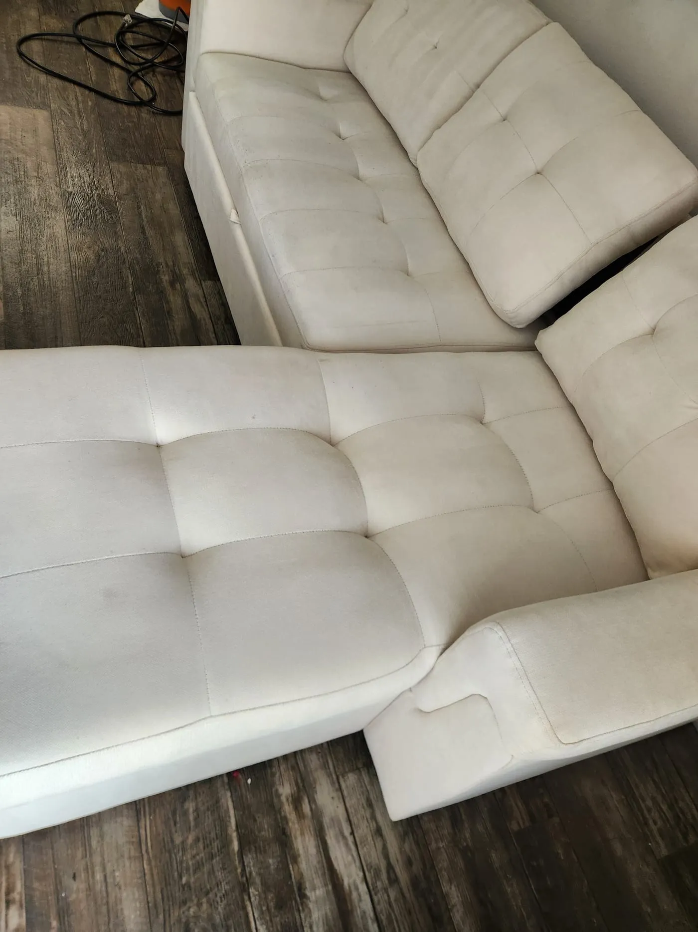 White tufted sectional deep-cleaned and brightened